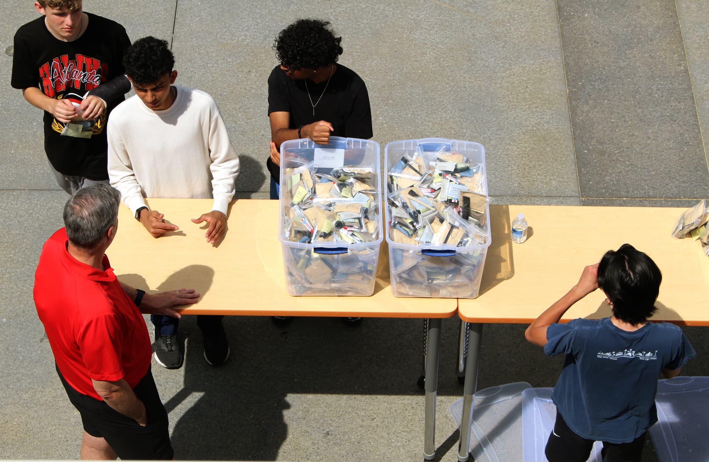 Overhead shot of Hands of Hope volunteers assembling kits