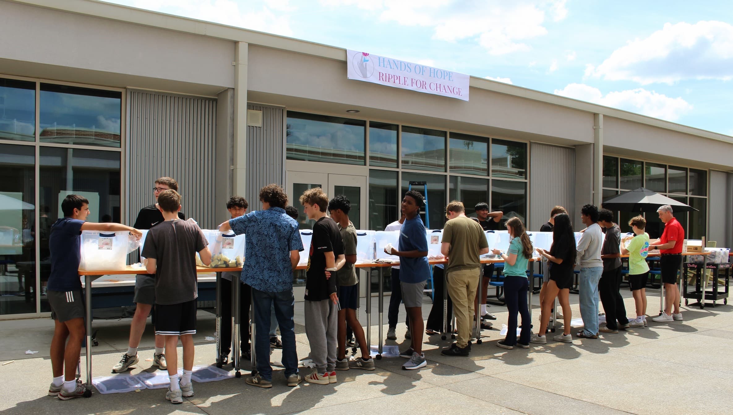 Wide view of Ripple for Change tables and attendees