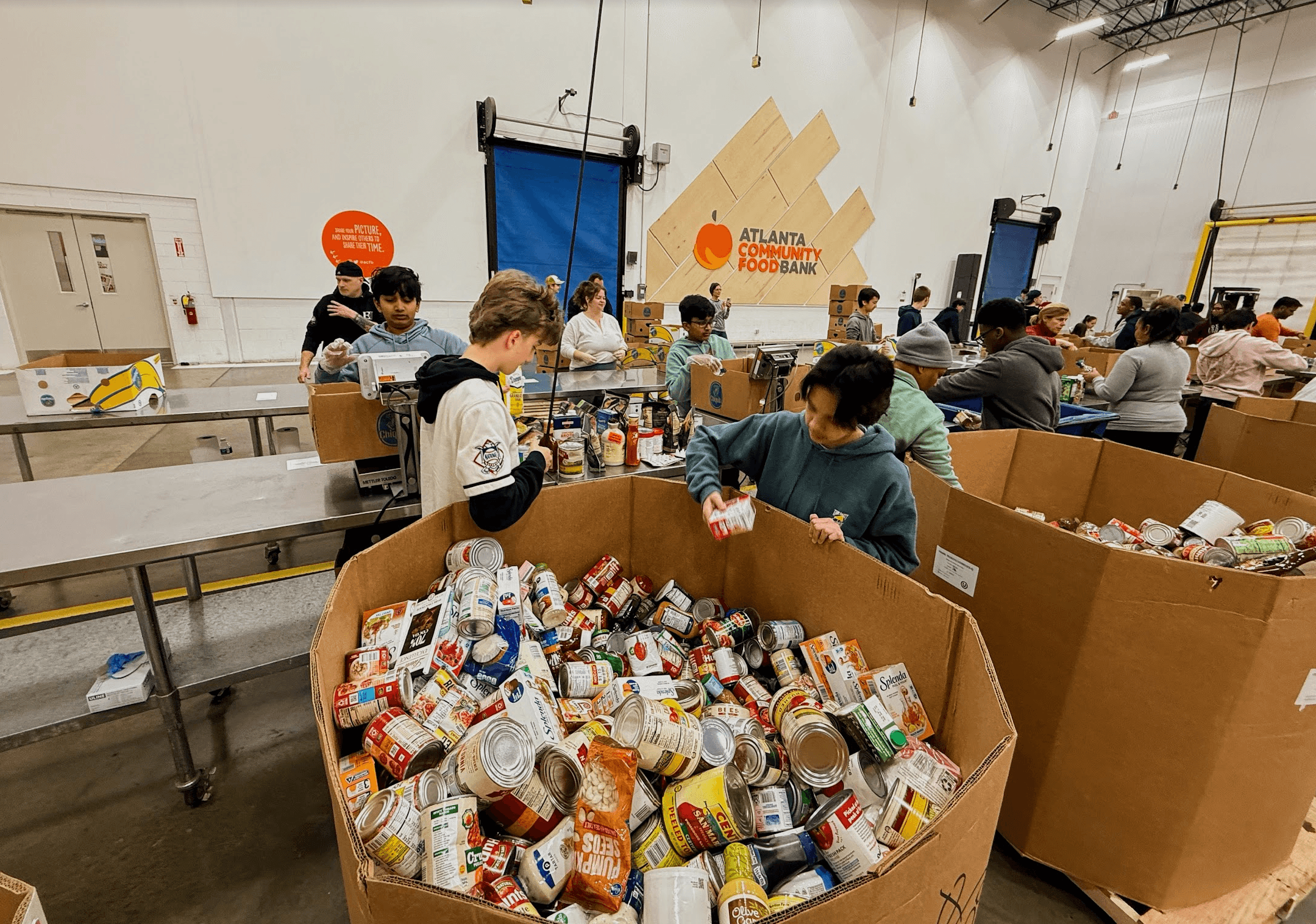 Volunteers coordinating supplies at a Hands of Hope Ripple for Change assembly