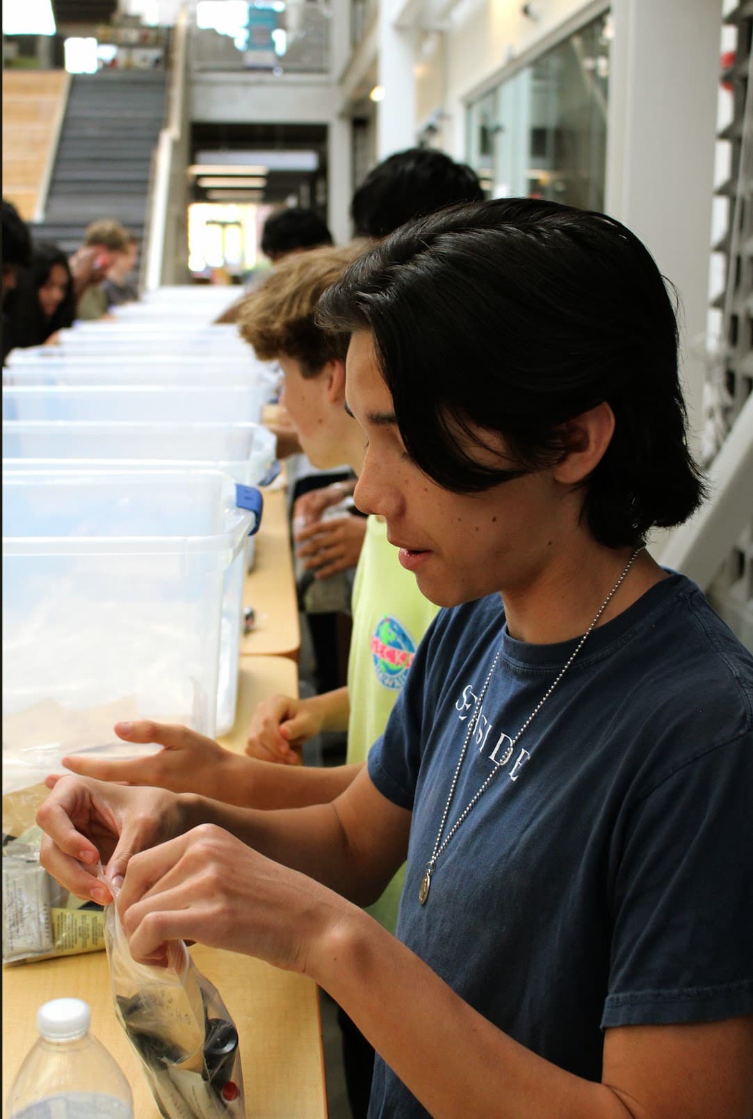 Hands of Hope students packing care kits together at Ripple for Change